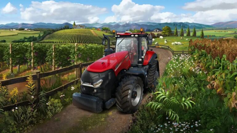 טרקטור בצבע אדום חורז שדות במשחק הסימולציה Farming Simulator 22